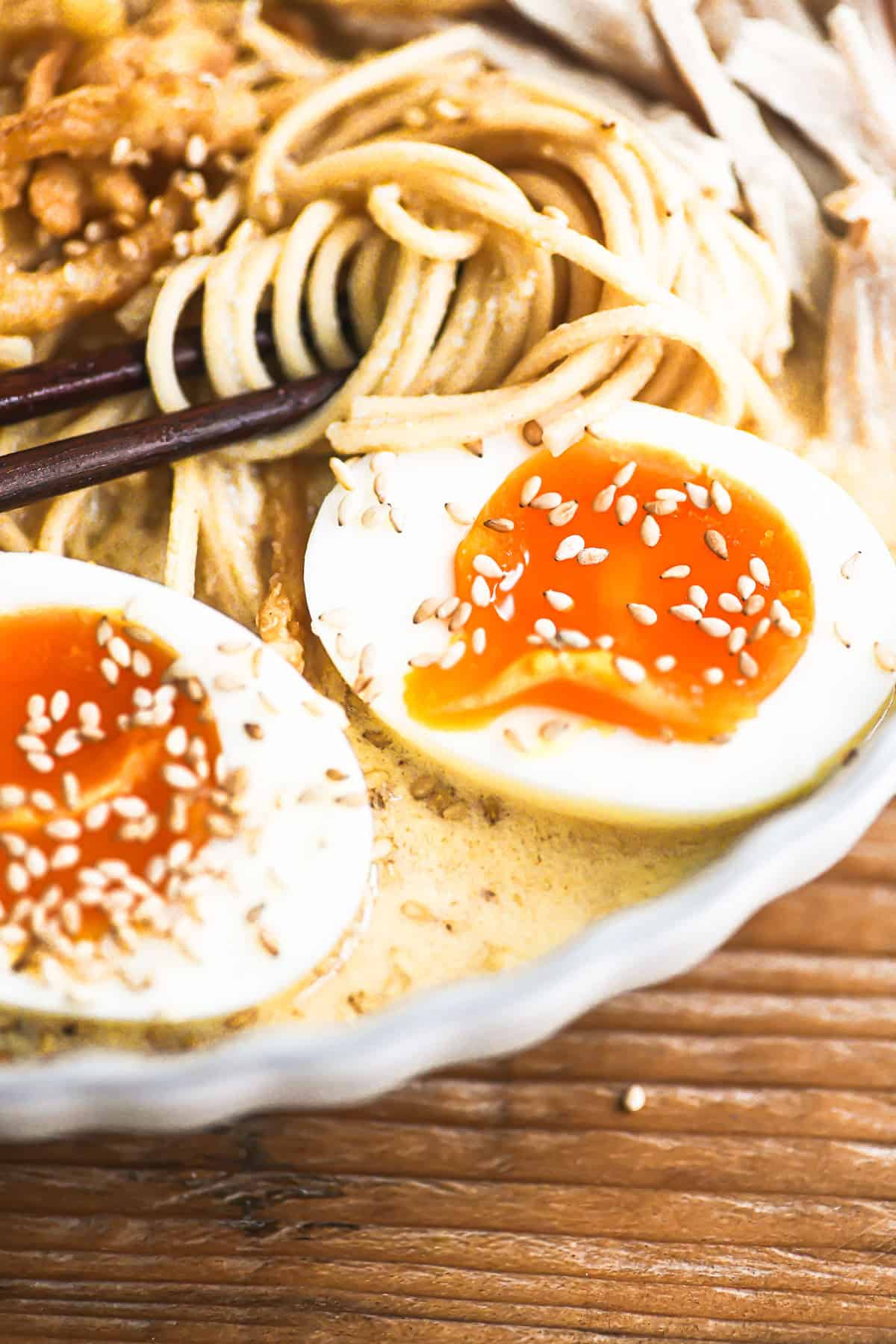 close look at jammy eggs in a creamy miso turkey ramen bowl