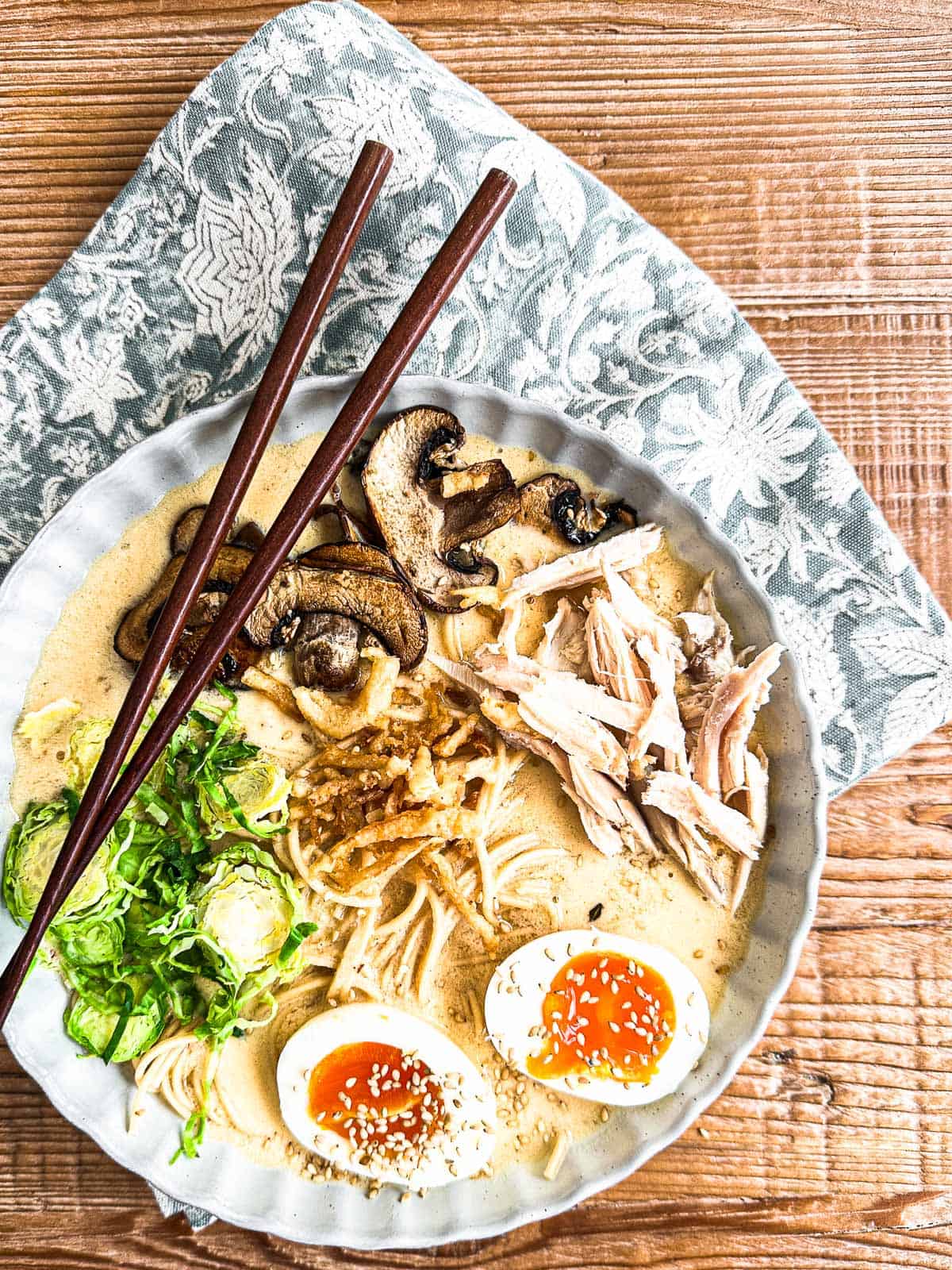 creamy turkey ramen in a bowl with chopsticks