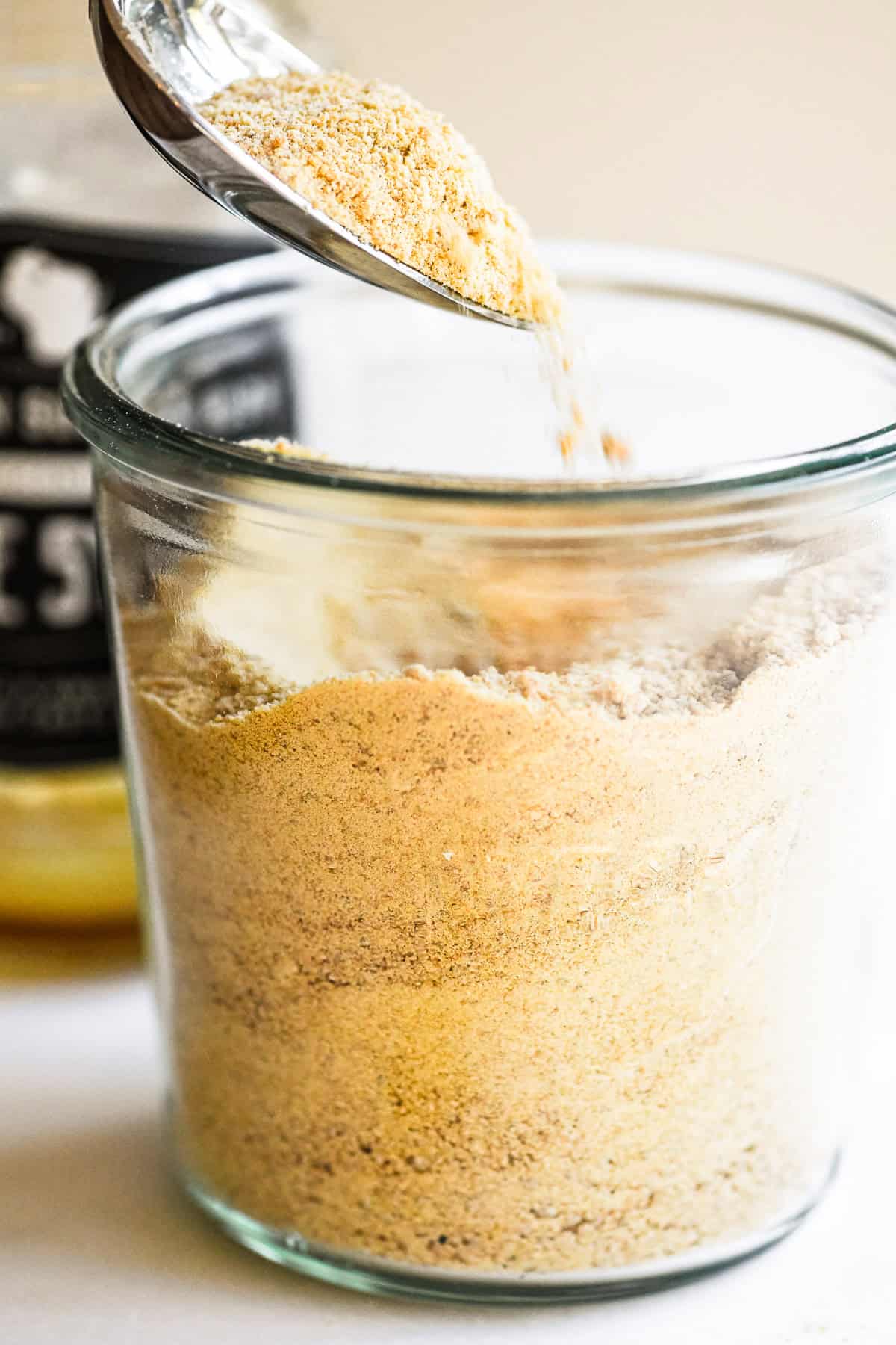 Homemade maple sugar in a small Weck jar.