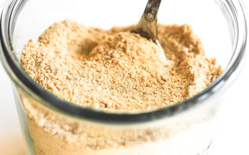 a small jar of homemade maple sugar, with spoon.