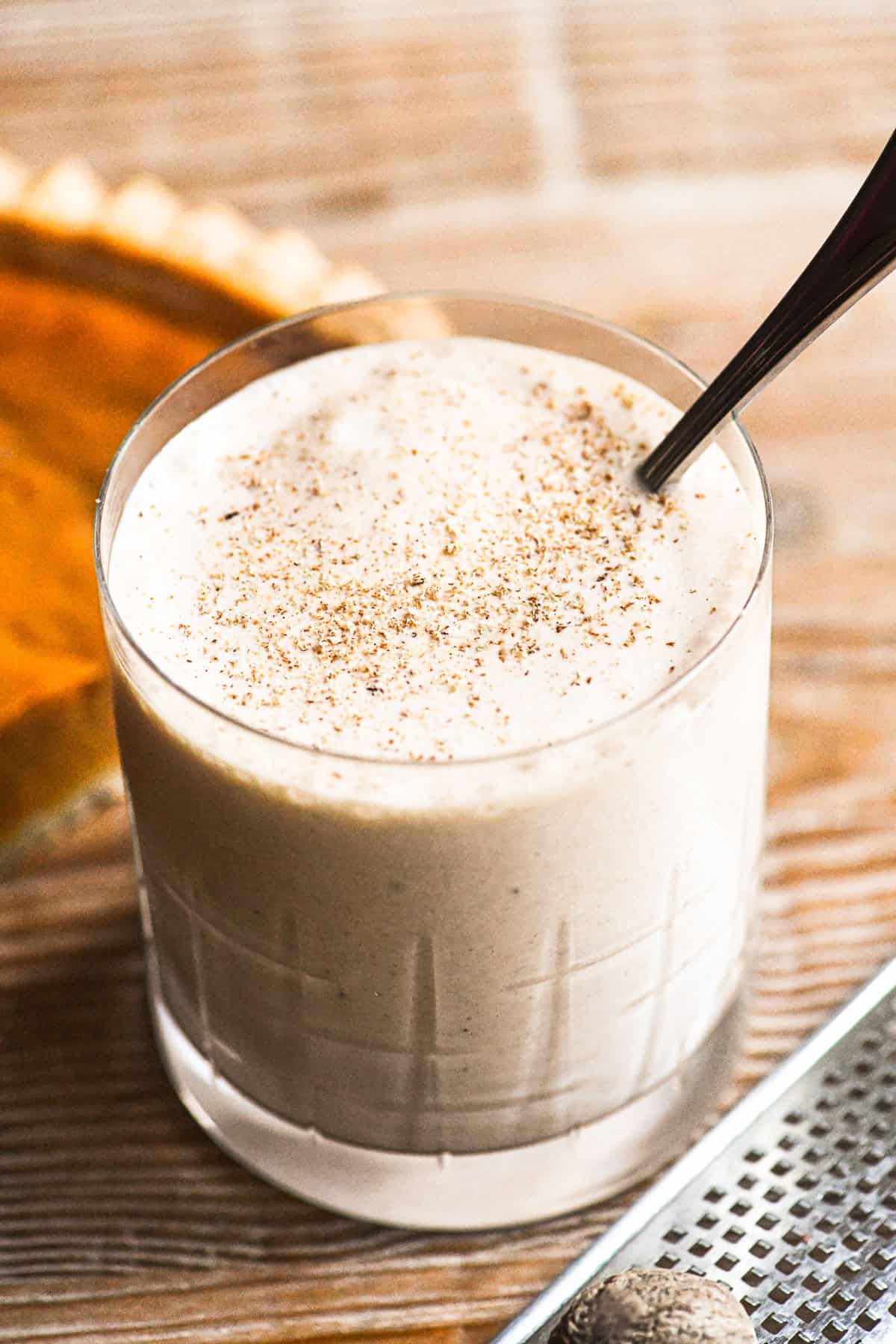 a pumpkin pie bourbon milkshake in a cocktail glass.