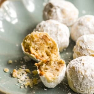 walnut ginger butter balls on a blue plate.