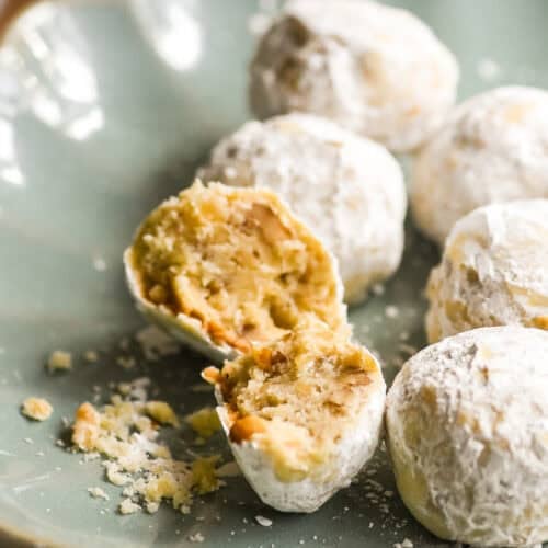 walnut ginger butter balls on a blue plate.