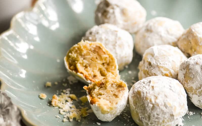 walnut ginger butter balls on a blue plate.