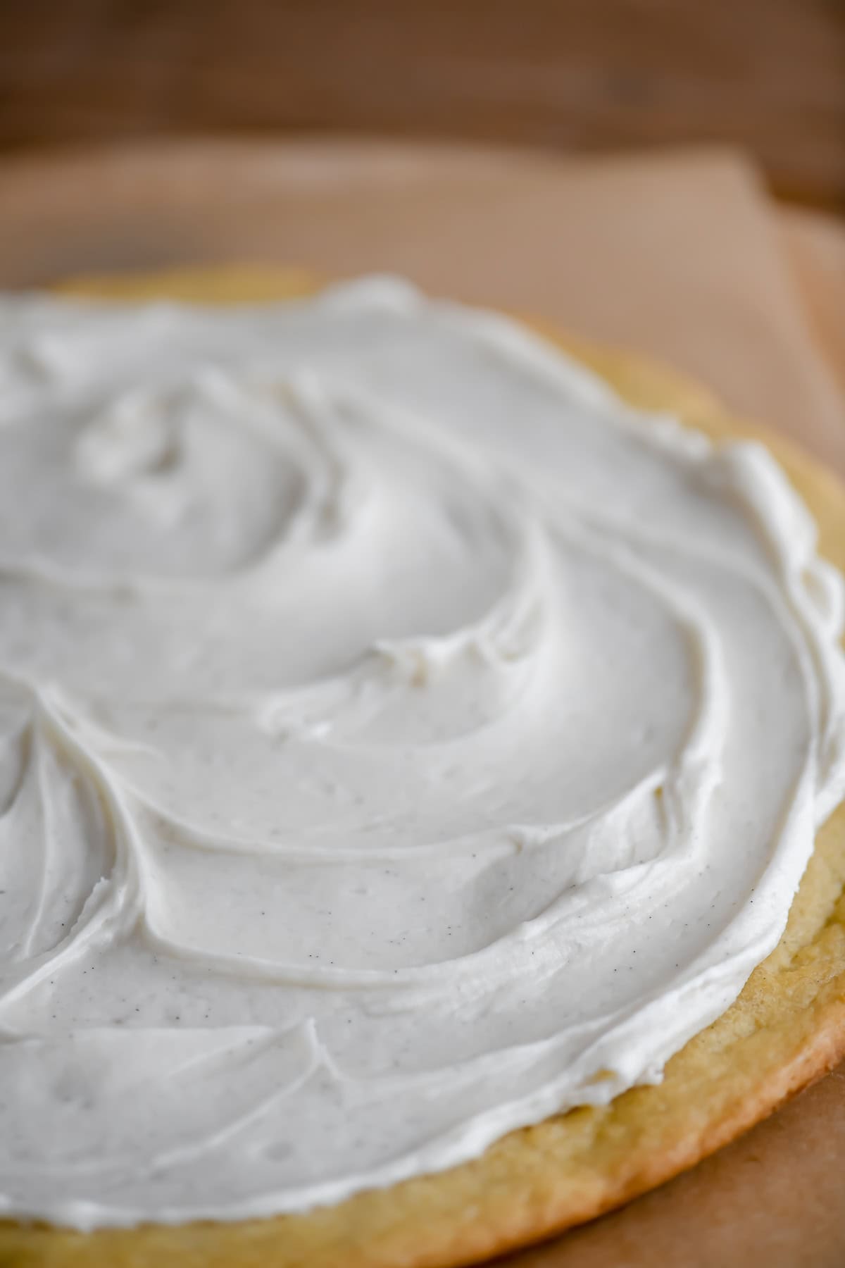 Vanilla frosting on a Christmas cookie pie.