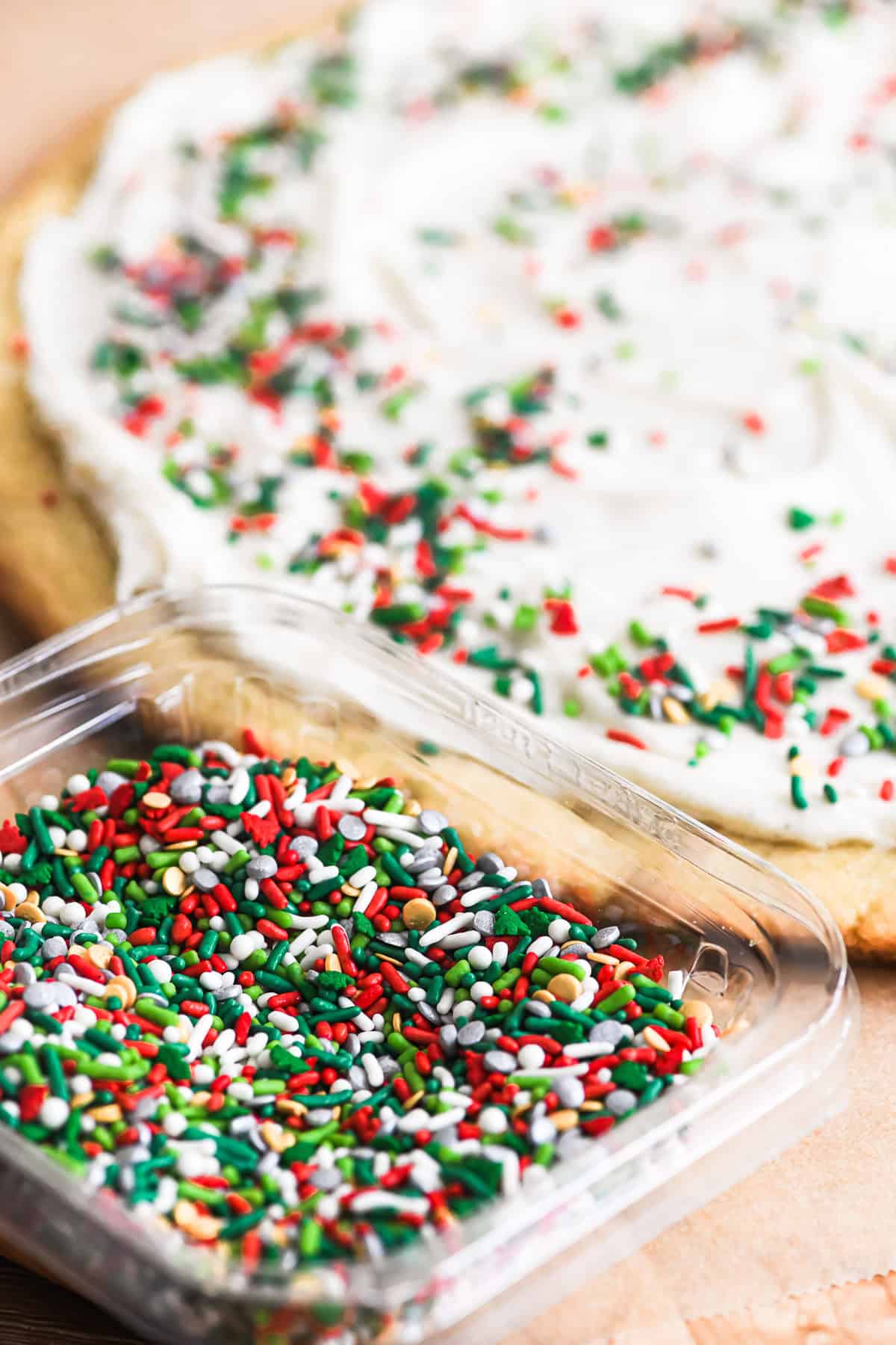 giant frosted Christmas cookie with holiday sprinkles