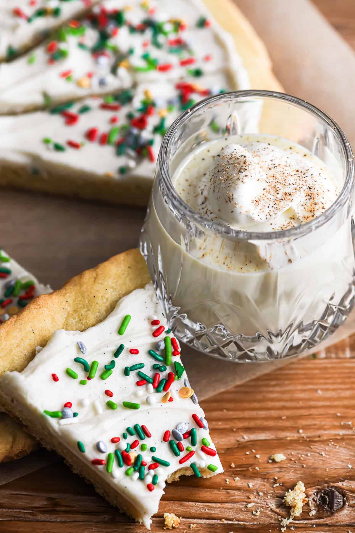 slice of Giant Christmas Cookie Pie with glass of eggnog