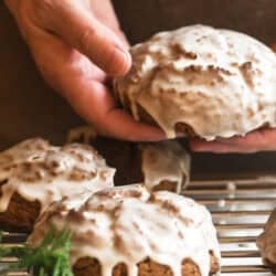 holding a glazed gingerbread scone.