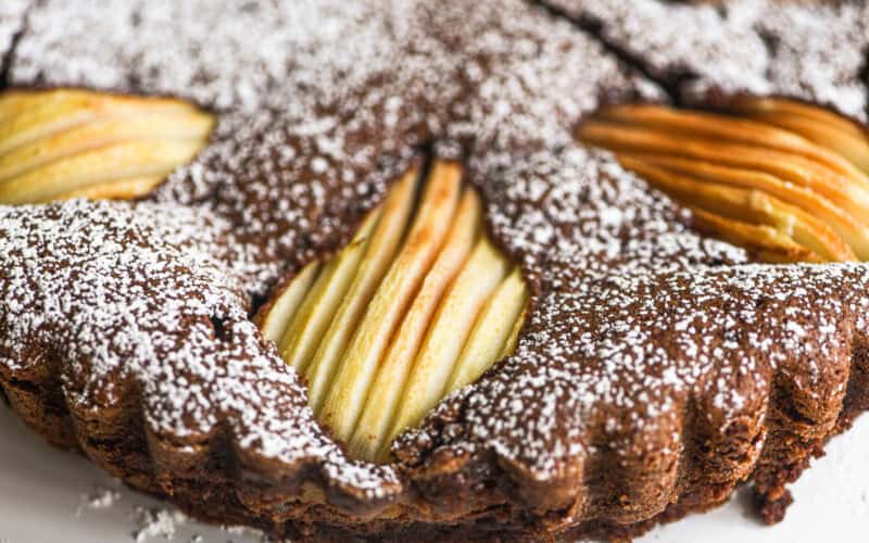 gluten free chocolate almond pear cake, topped with thin sliced pear halves.