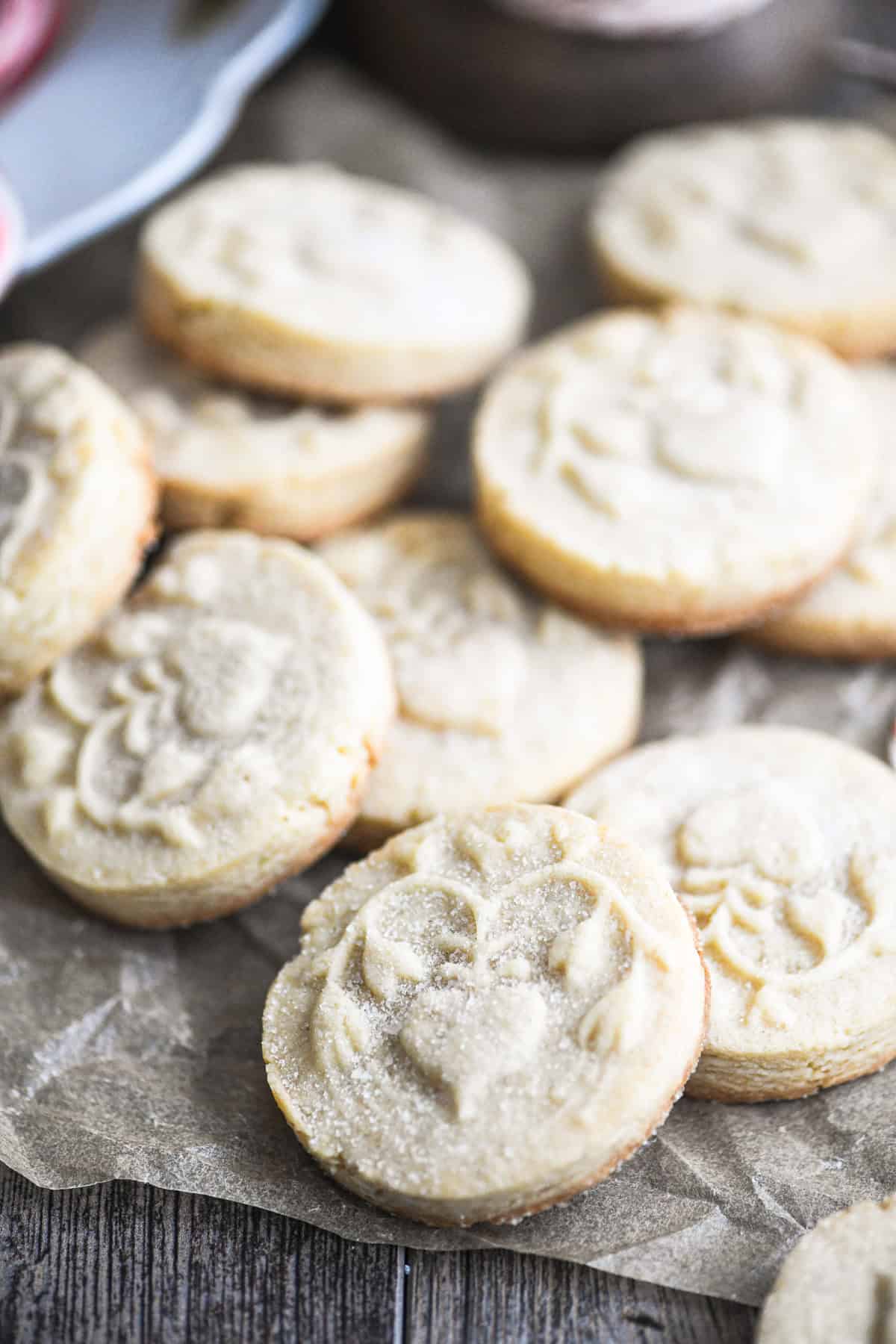 stamped marzipan shortbread cookies on parchment paper.