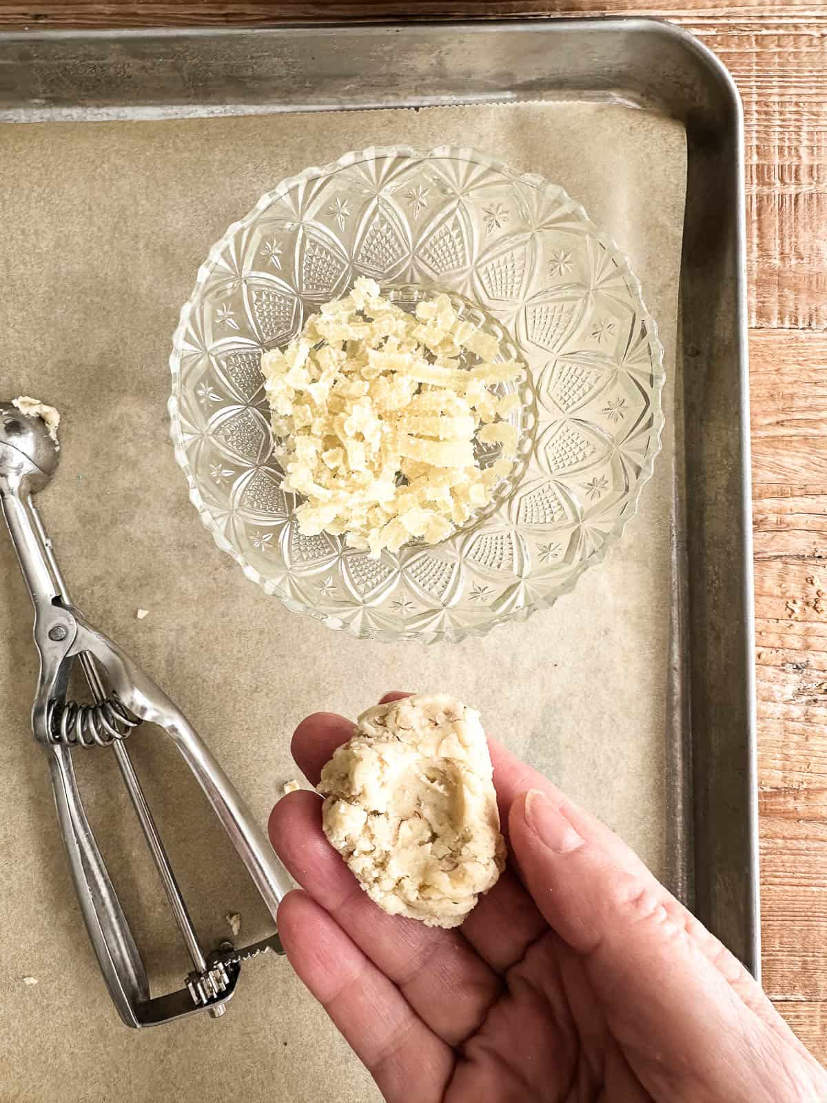 Making walnut ginger butter balls.