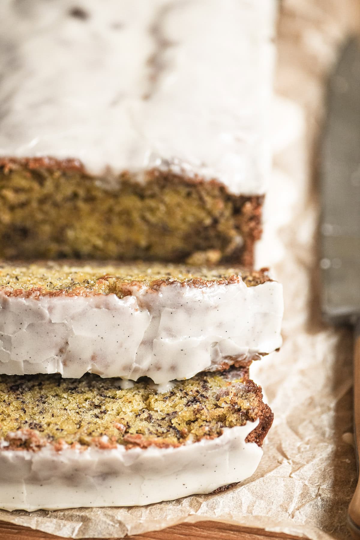 bourbon banana bread, sliced on parchment paper.