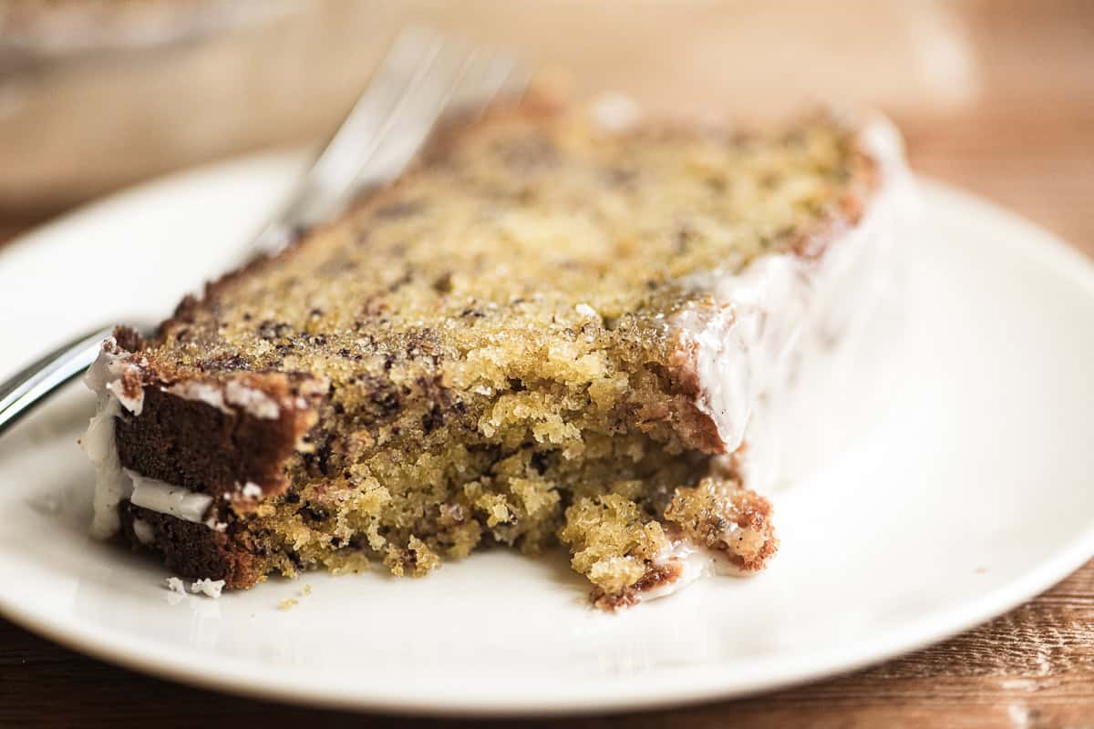 a slice of bourbon banana bread with bites taken.