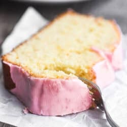 taking a bite of a slice of blood orange pound cake.