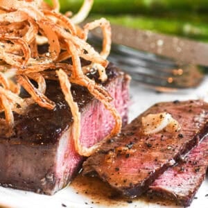 Perfectly cooked filet mignon topped with onion strings.