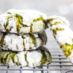 Lemony Pistachio Amaretti Cookies, stacked on a rack.