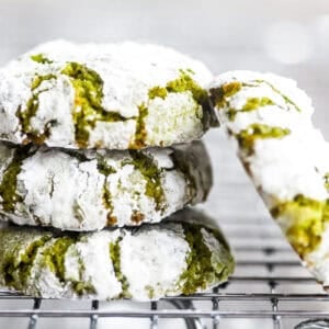Lemony Pistachio Amaretti Cookies, stacked on a rack.