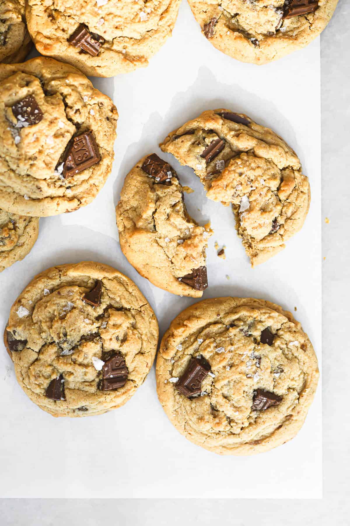soft and chewy peanut butter chocolate chip cookies on parchment paper.