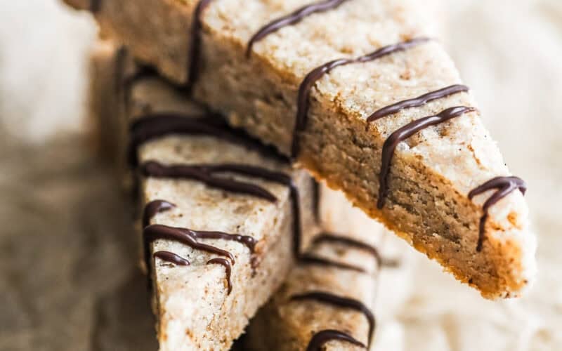 wedges of Turkish Coffee Shortbread stacked and drizzled with chocolate.