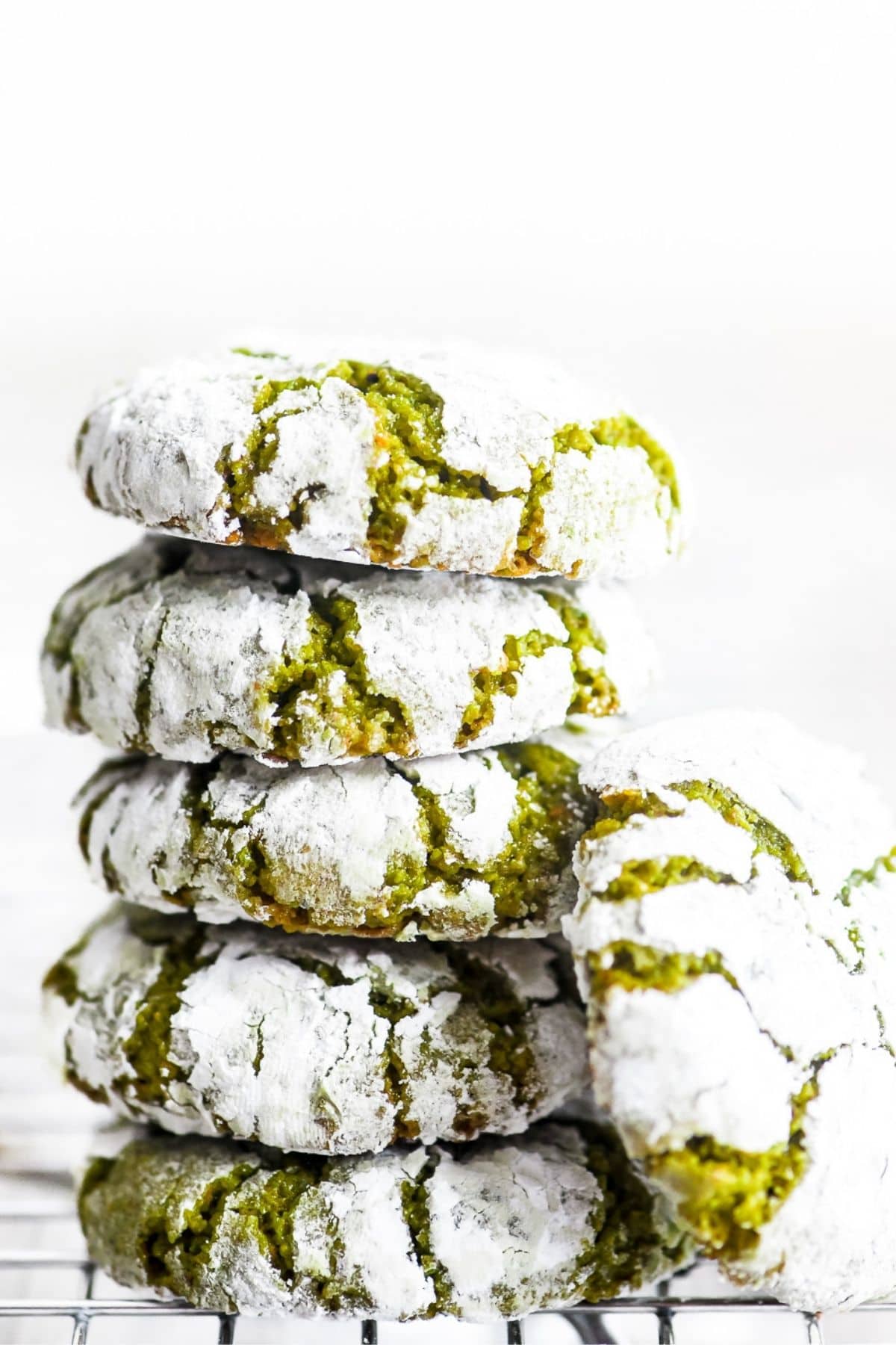 a stack of green pistachio amaretti cookies
