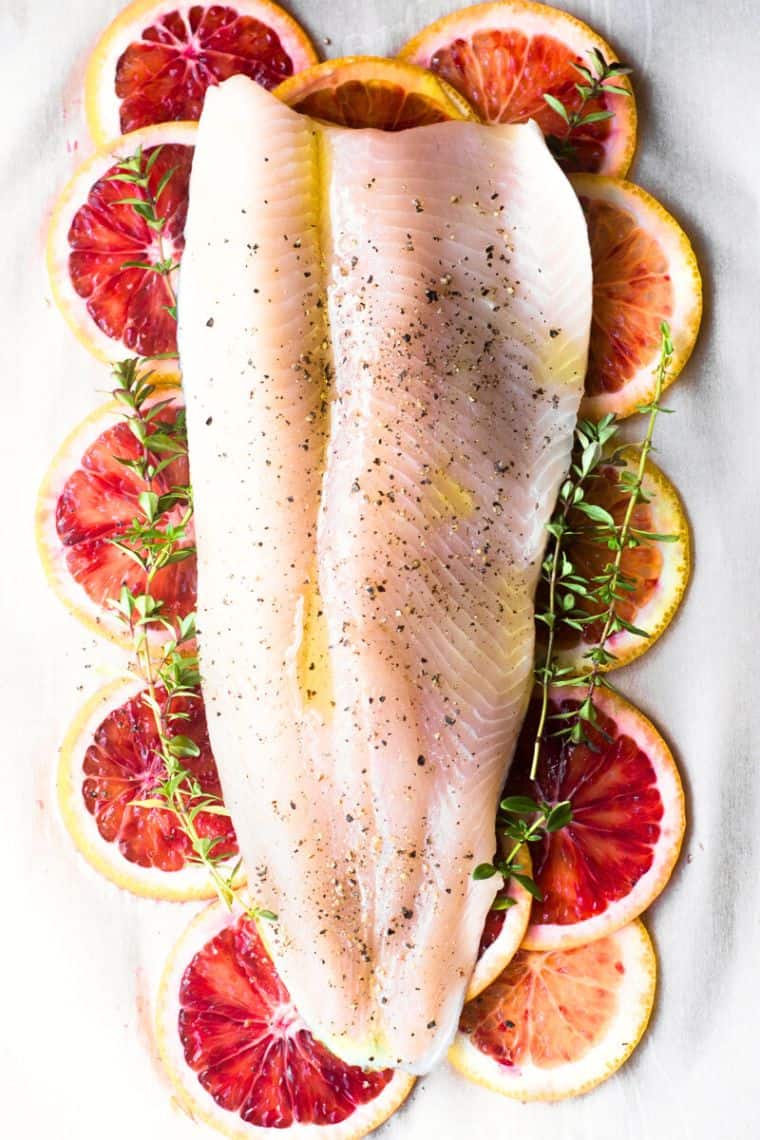 fish baked in parchment paper packet with blood oranges.