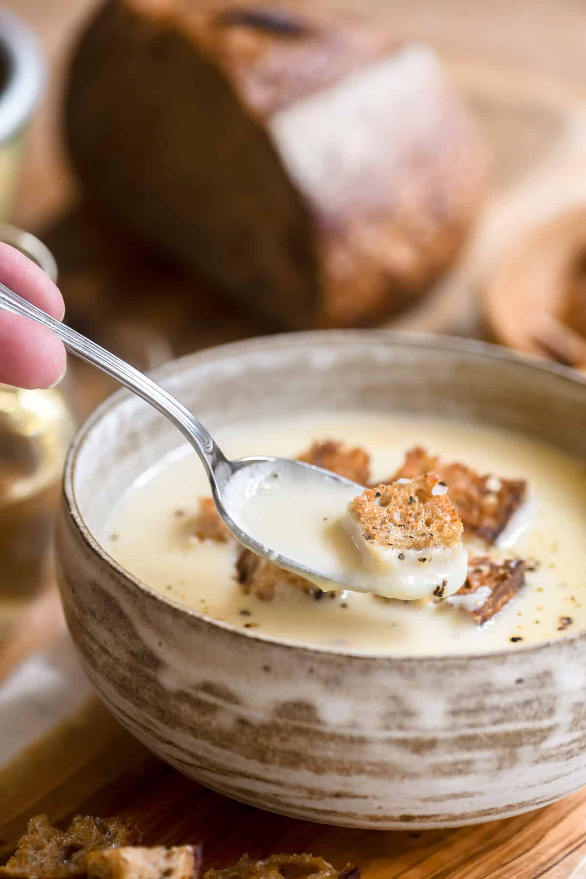 cheese fondue soup topped with rustic croutons.