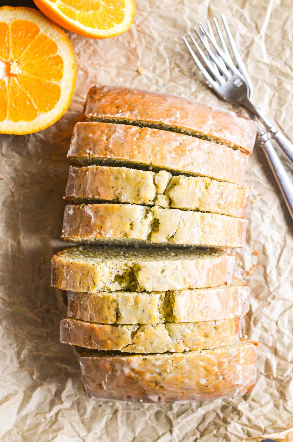 a loaf of orange poppy seed bread, sliced.