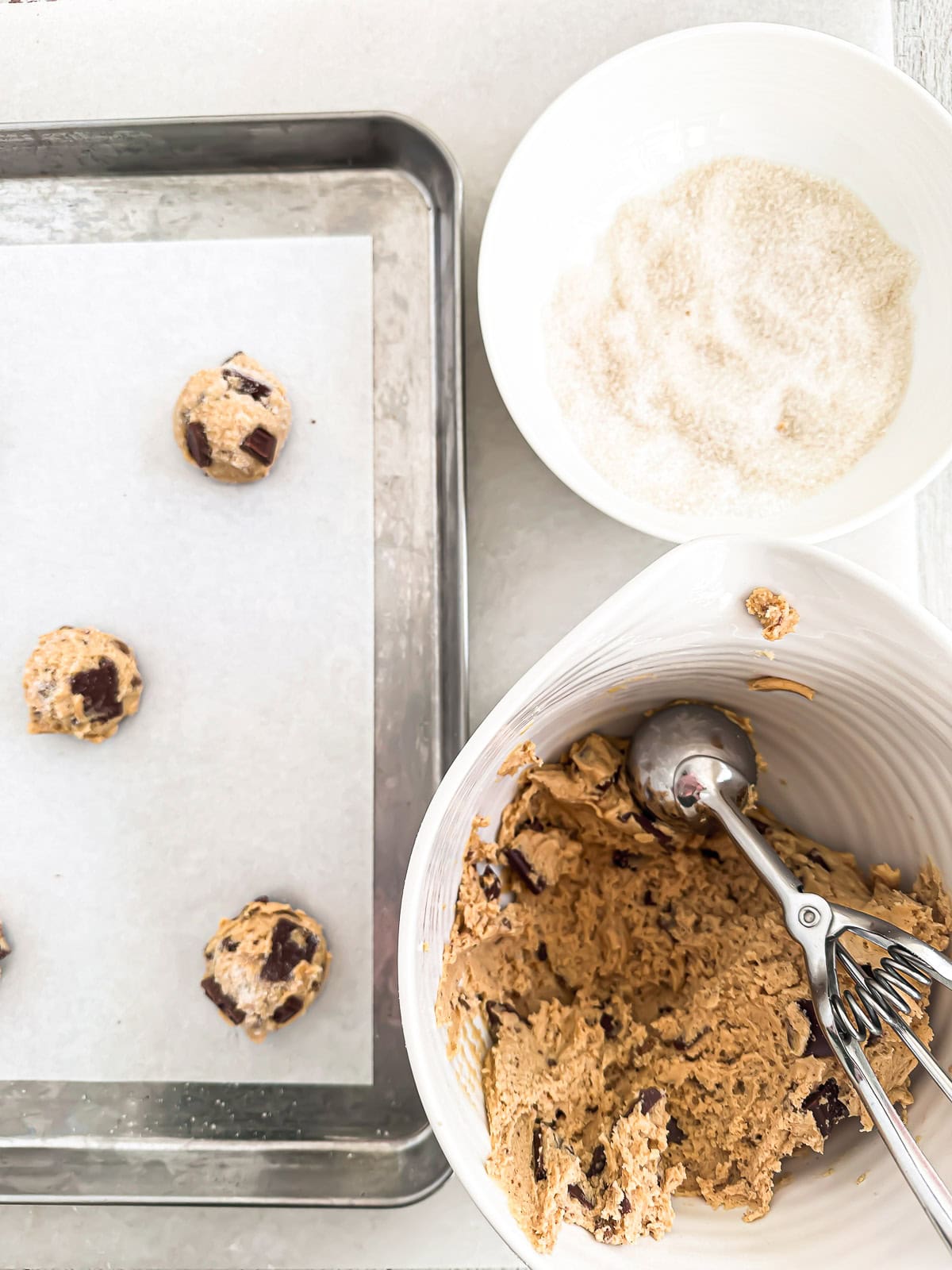 scooping peanut butter chocolate chip cookie dough.