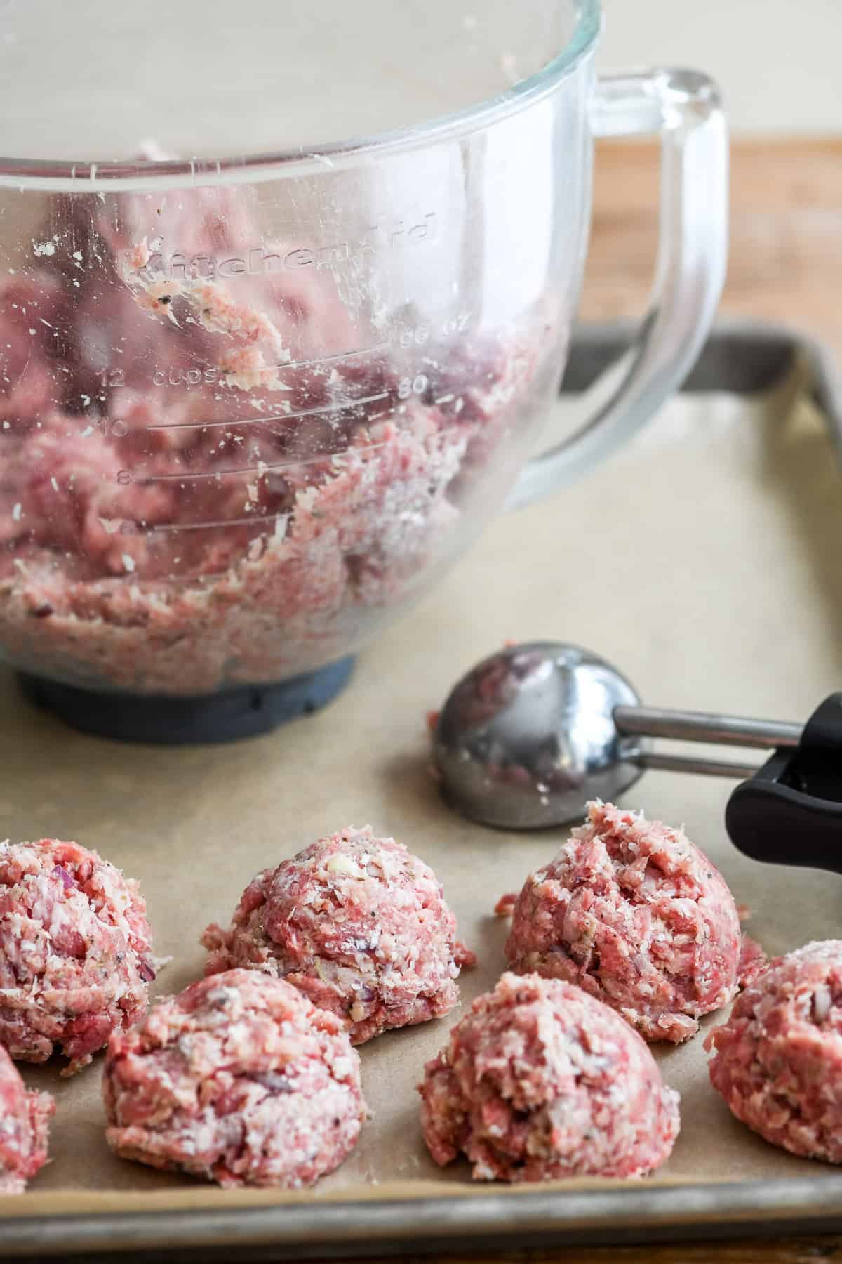 making ricotta meatballs in a stand mixer and portioning out with an ice cream scoop.