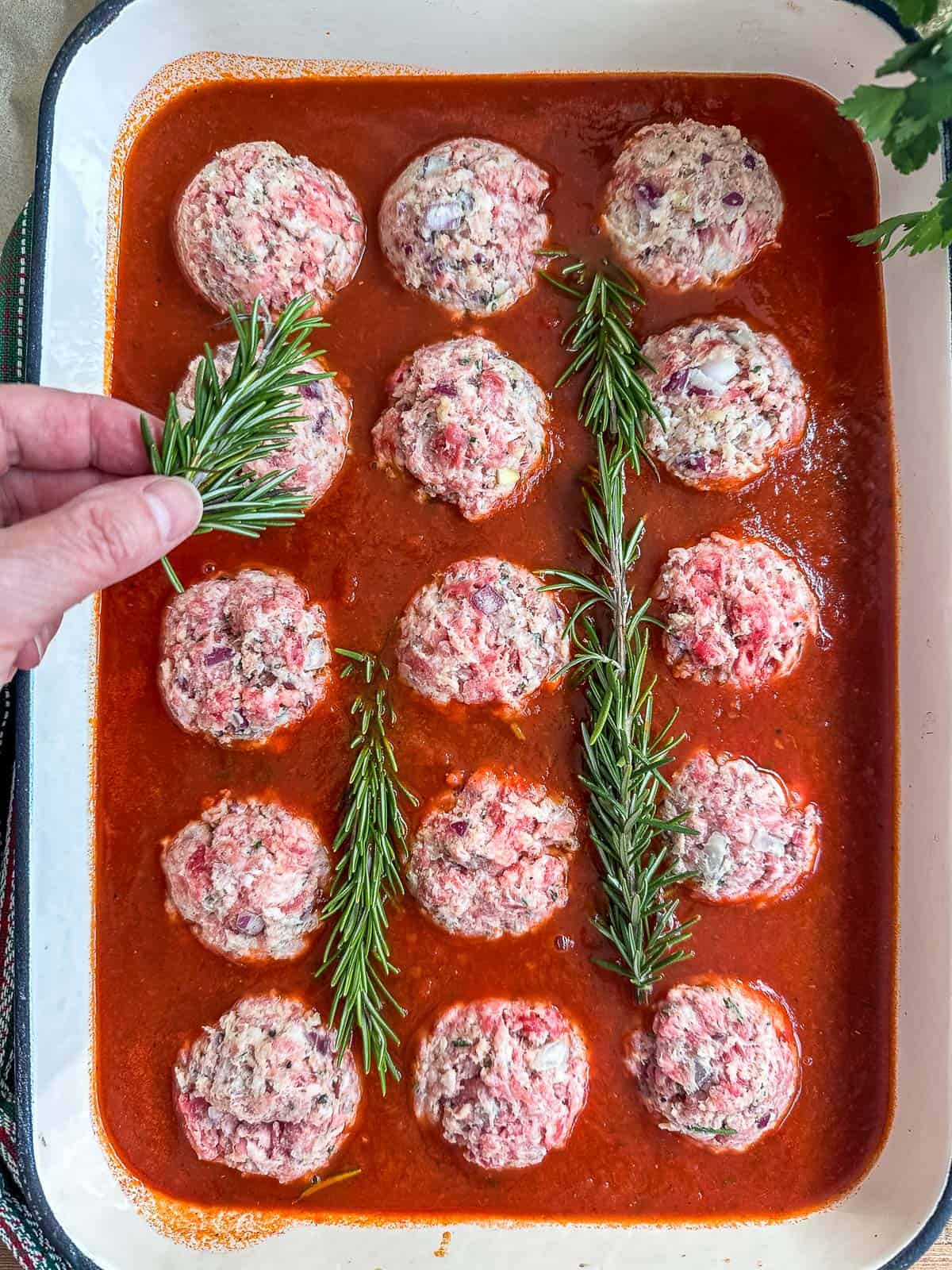 Ricotta meatballs in sauce ready to bake.