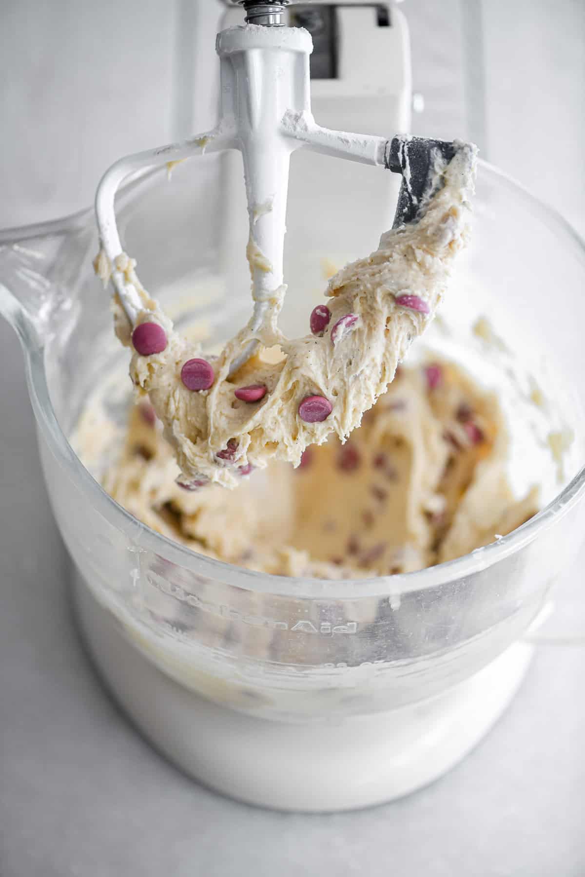 Mixing ruby chocolate chip cookie dough in a stand mixer.
