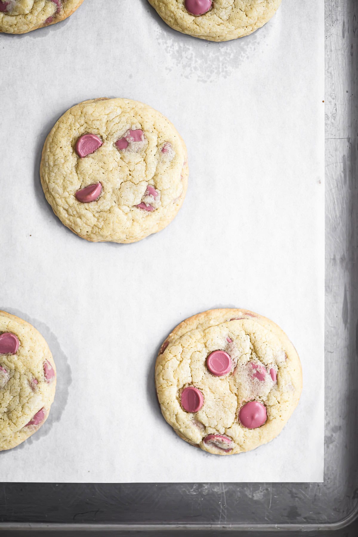 ruby chocolate chip cookies on parchment lined pan.