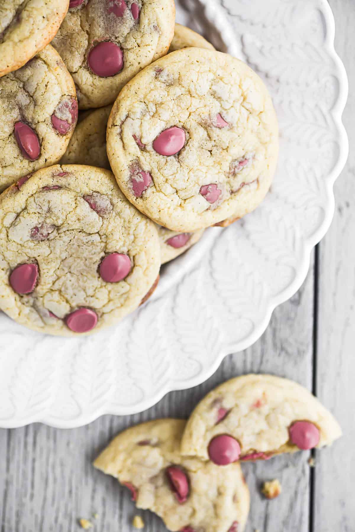 Ruby chocolate chip cookies on a white plate.