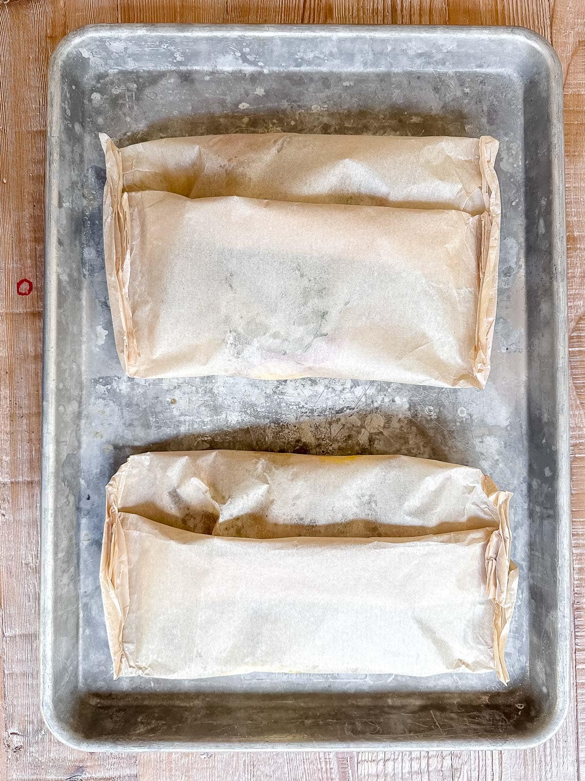shrimp packets on baking sheet.