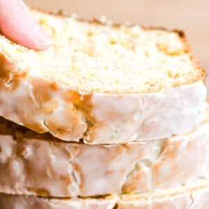 A stack of slices of pineapple banana bread, glazed.