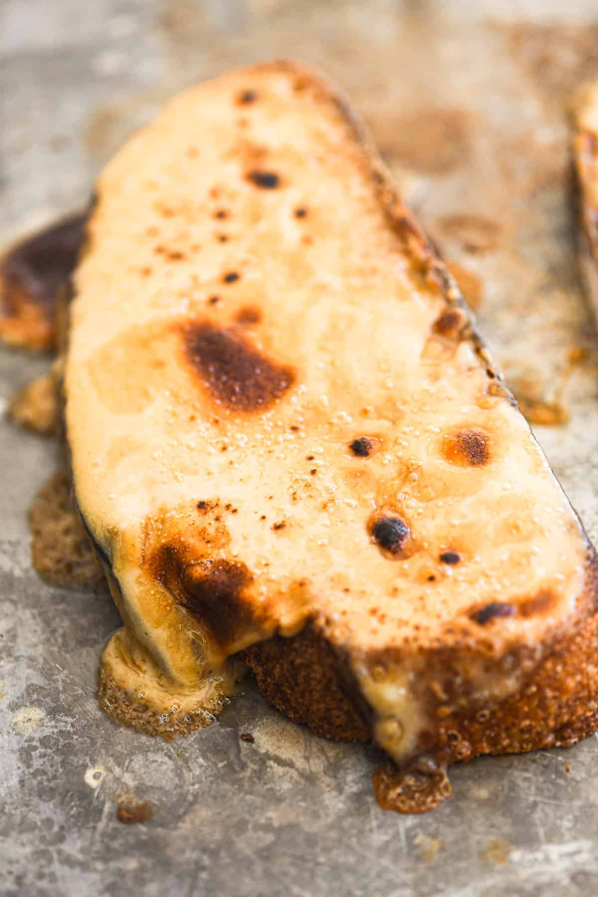 Broiled Welsh Rarebit, dripping with beer cheese sauce.