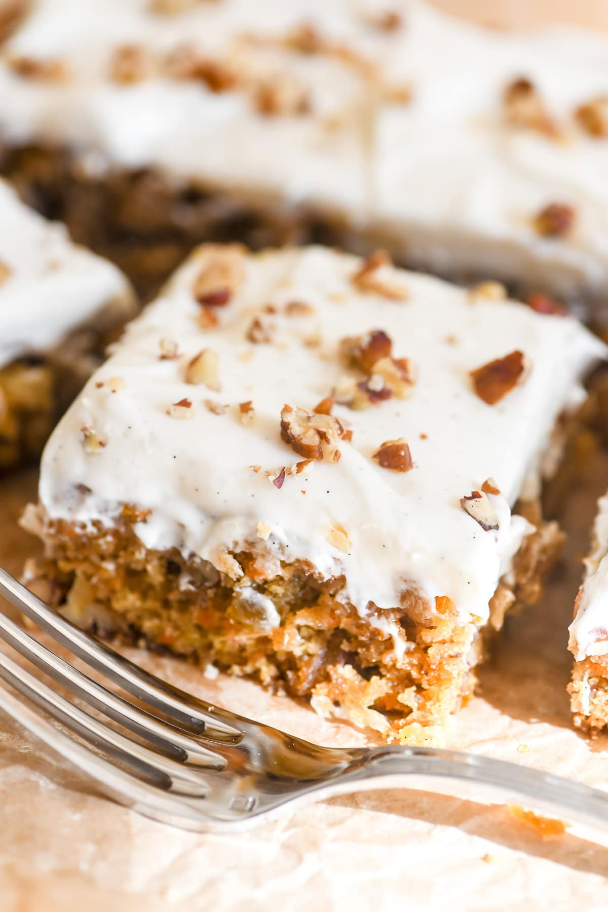 carrot cake bars, sliced, with fork.