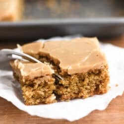 a slice of Mary Berry's coffee fudge traybake on parchment paper.