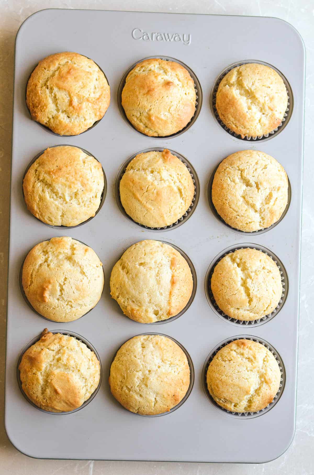 glazed buttermilk doughnut muffins in a pan.