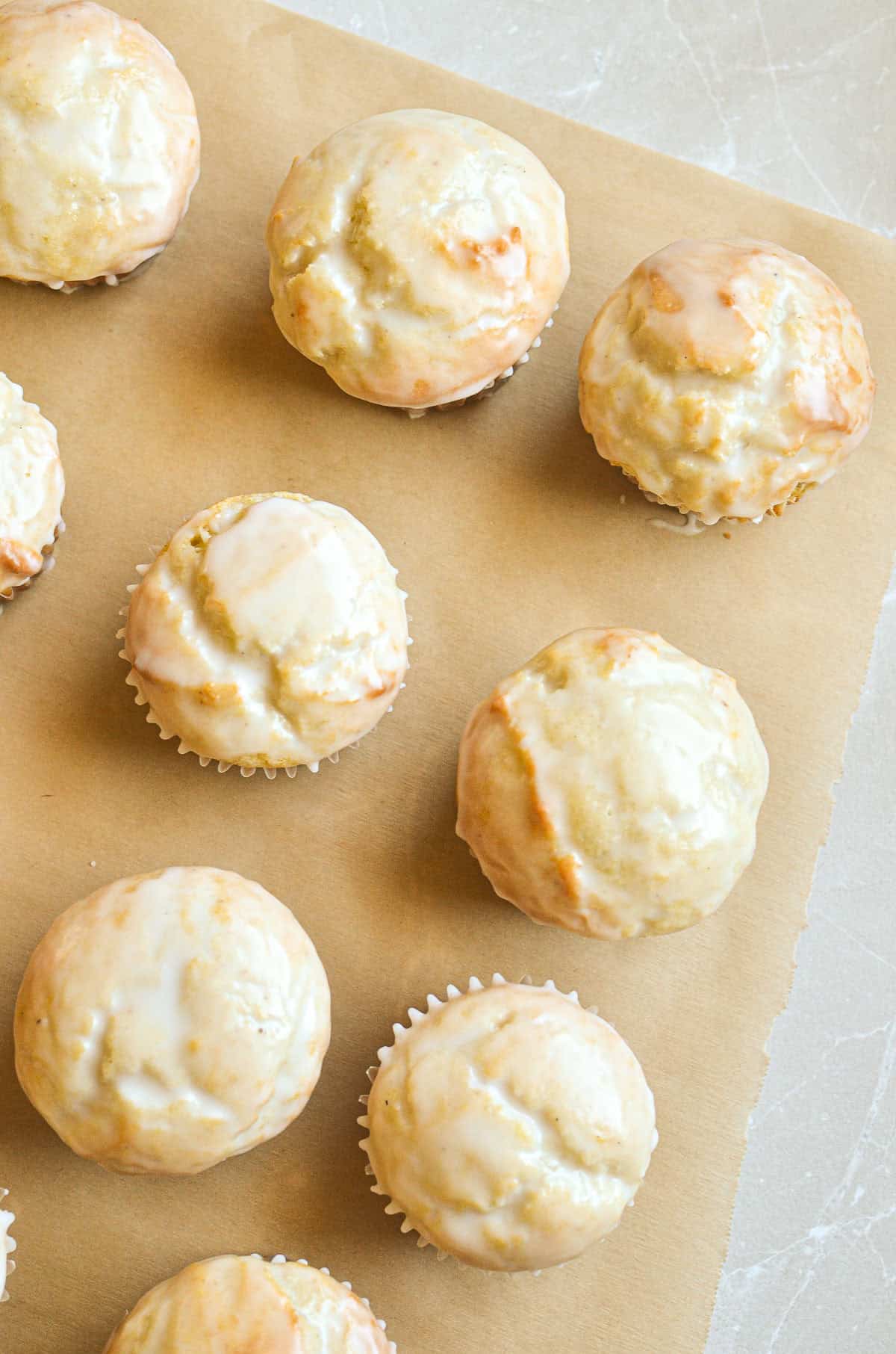 glazed buttermilk doughnut muffins on parchment paper.