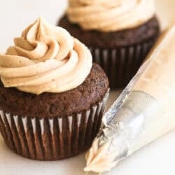 peanut butter buttercream piped onto chocolate cupcakes.