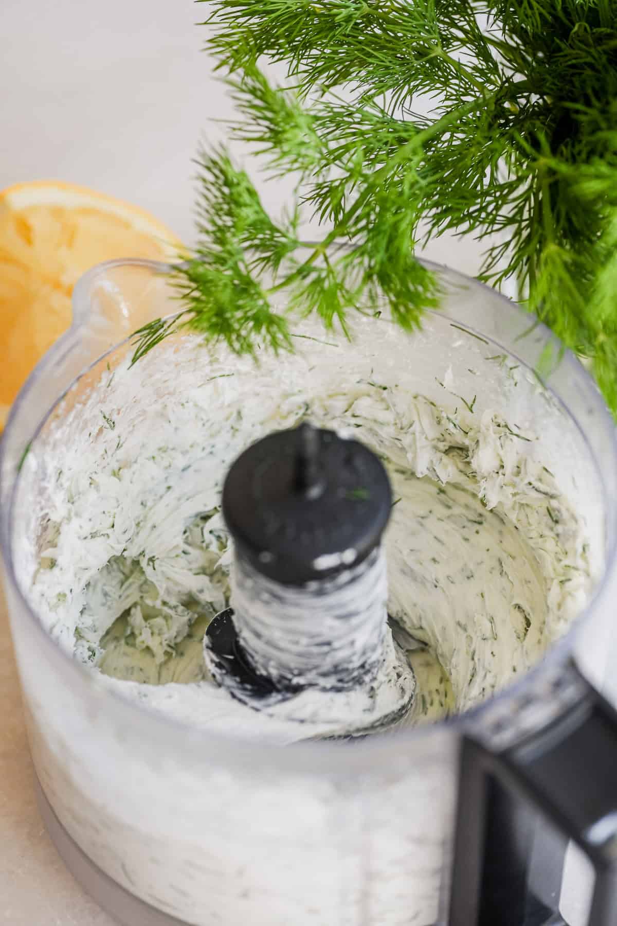 making dilled creamcheese for whitefish salad bagels.