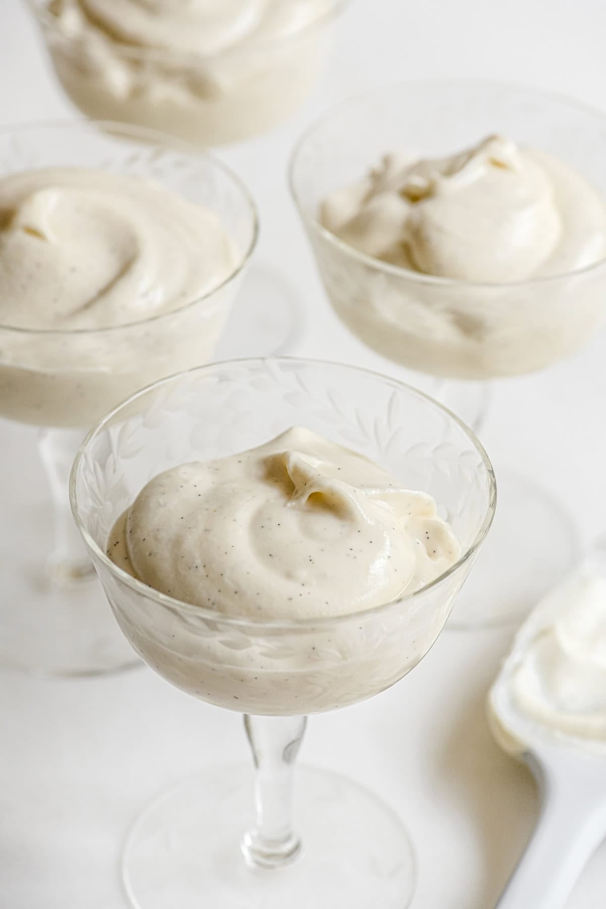 white chocolate mousse in vintage dessert glasses.