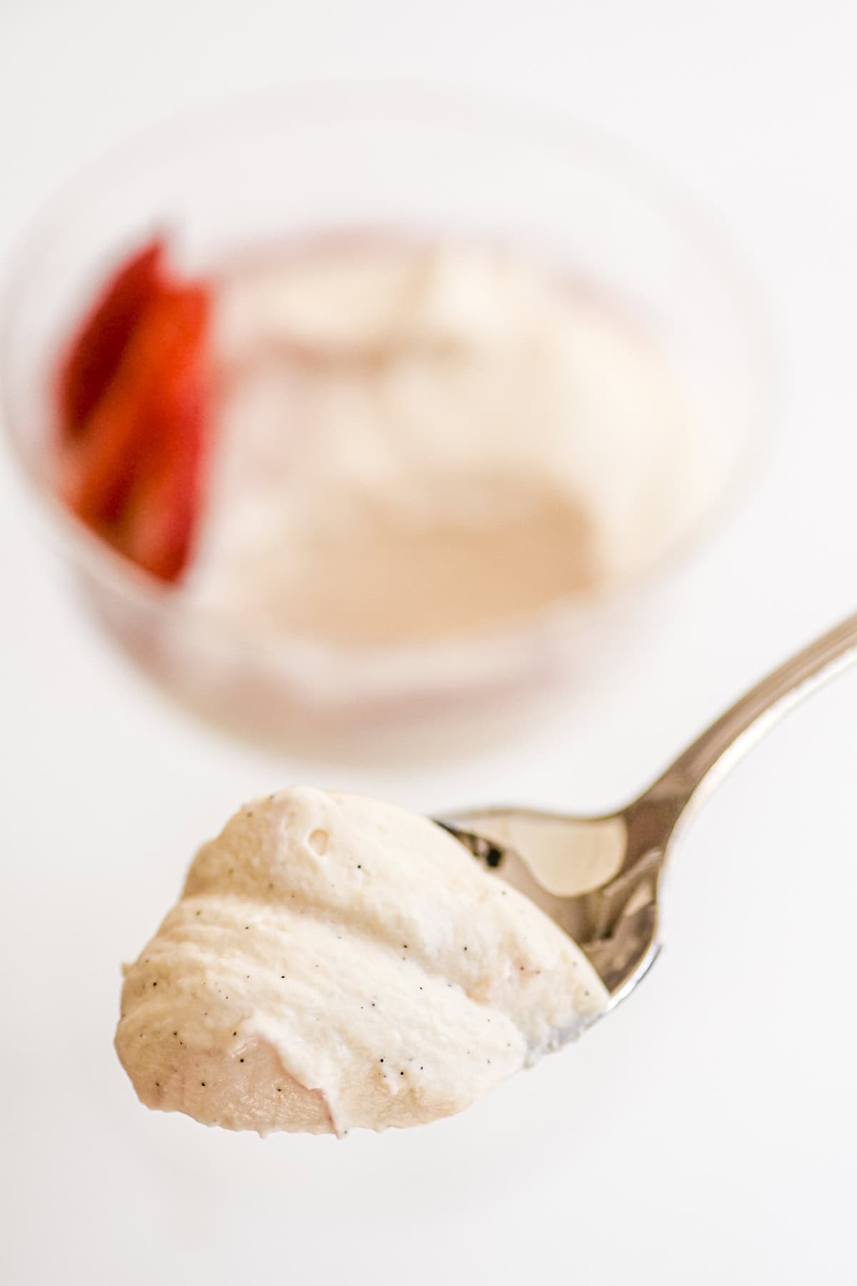 close look at a spoonful of white chocolate mousse.