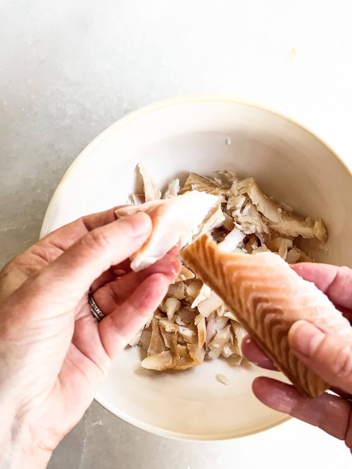 Flaking smoked whitefish for salad