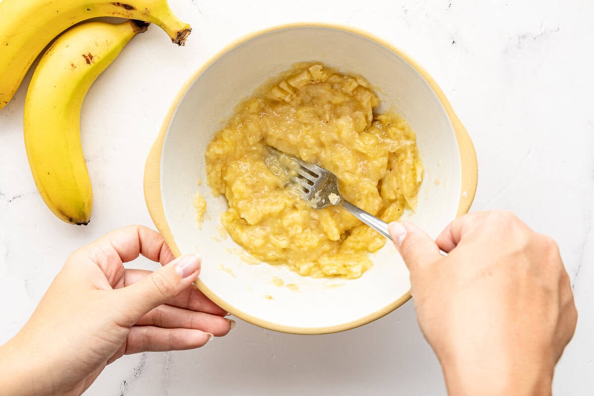 mashing banana for banana walnut cake