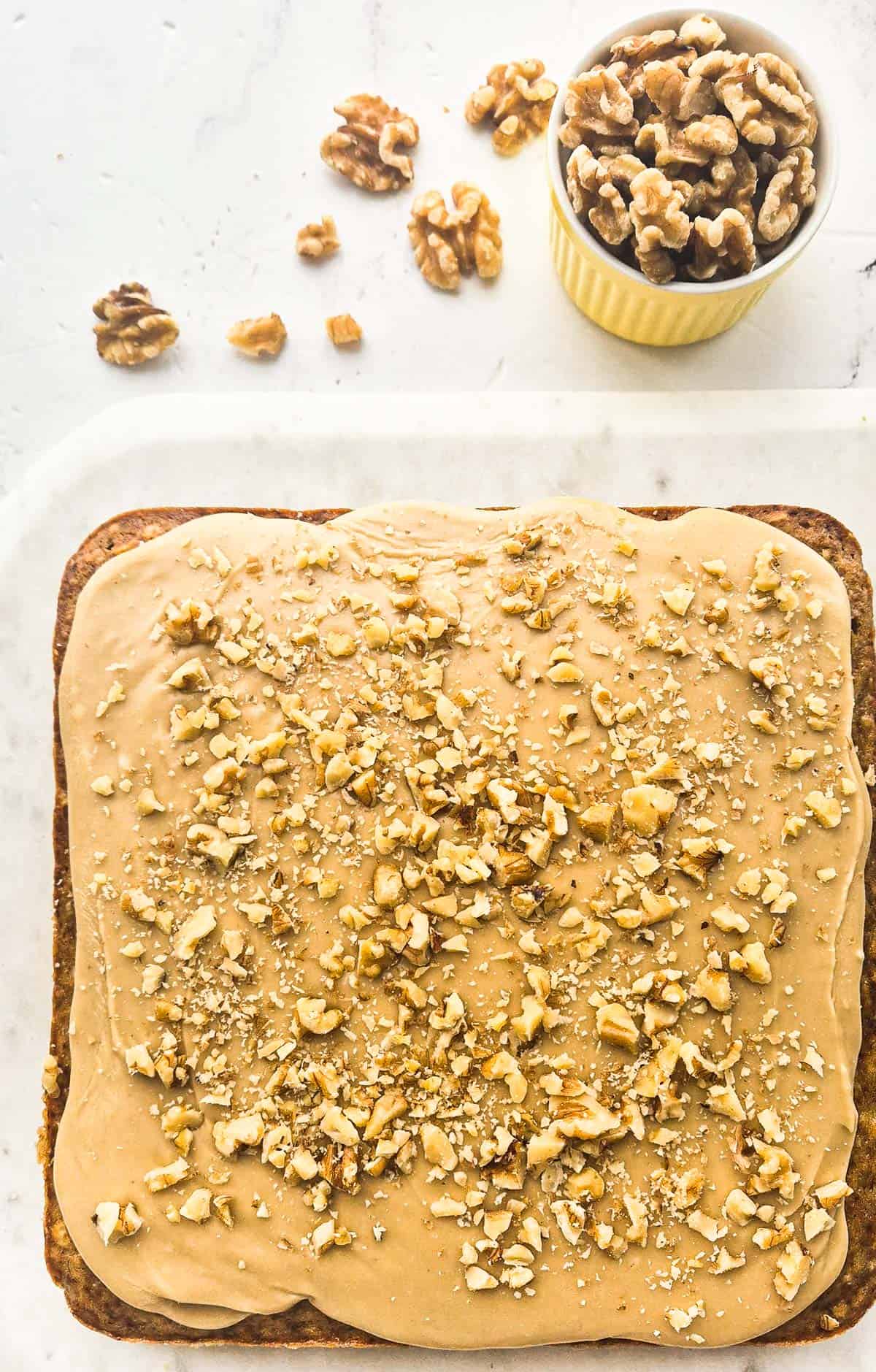 banana cake with caramel icing, unsliced.