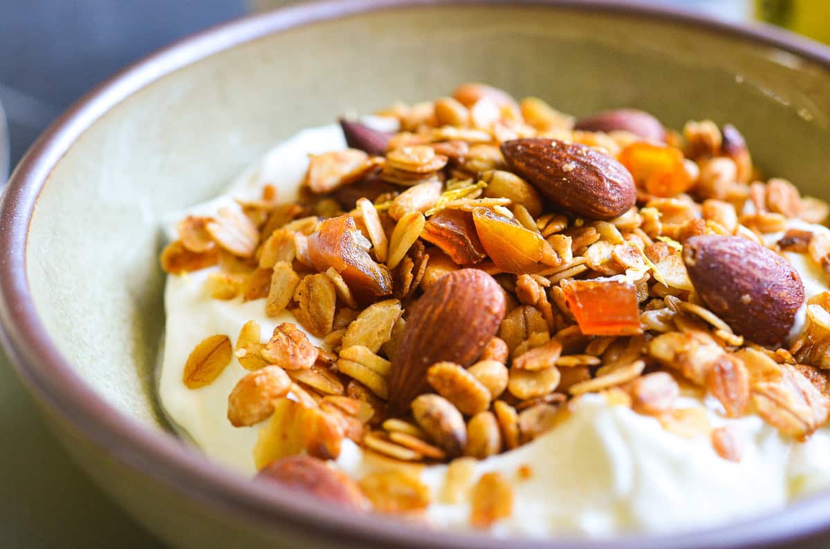 a bowl of olive oil granola with yogurt.
