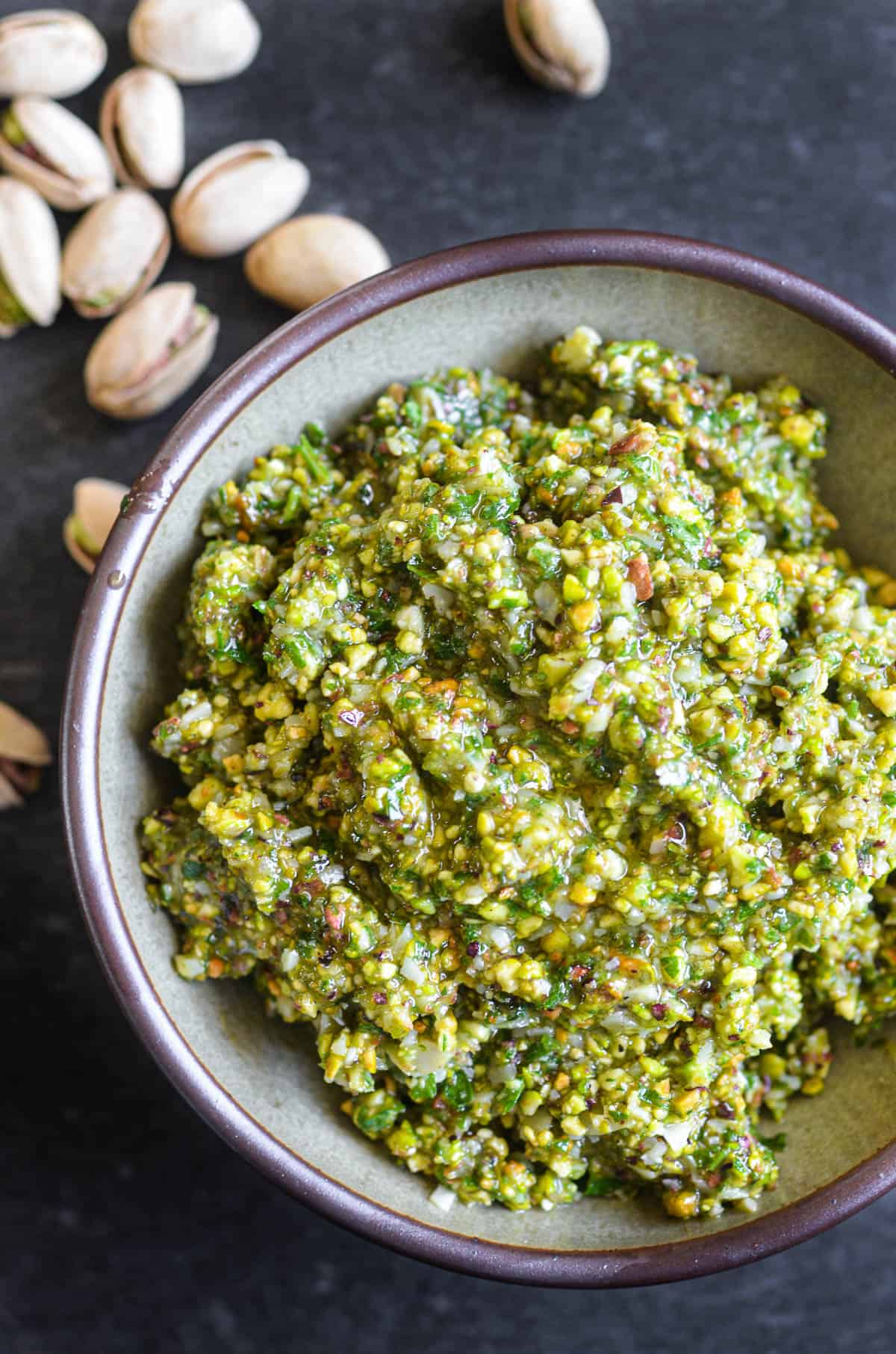 Gorgeous green pistachio pesto, in a bowl.