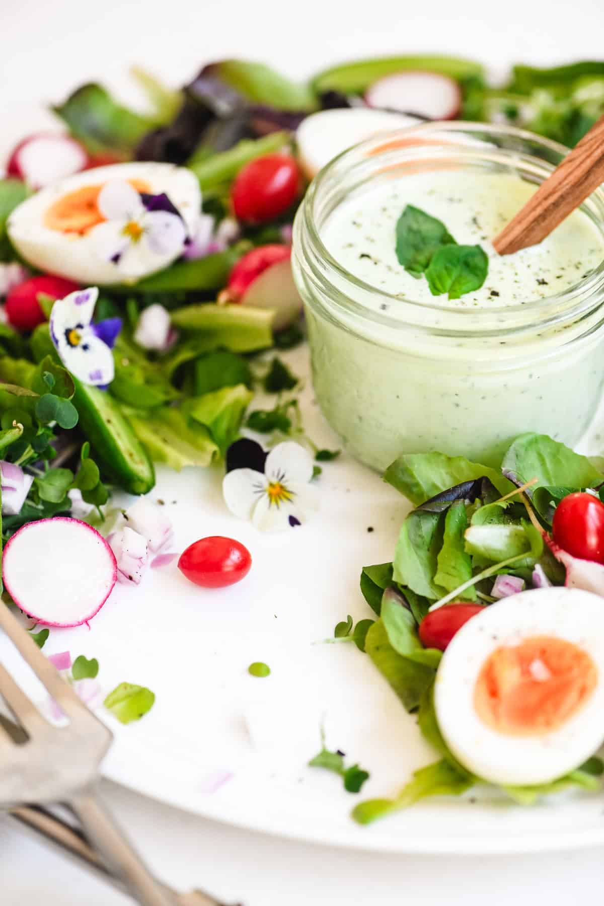 A spring wreath salad, partially eaten.
